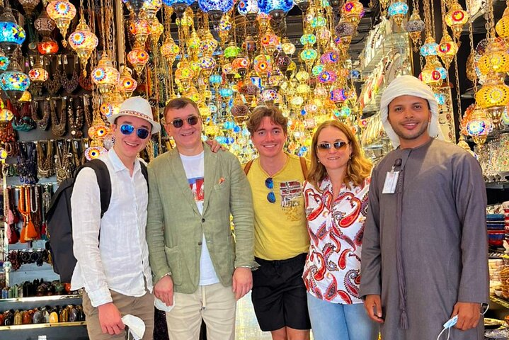 Discover the charm of Old Dubai while exploring lively markets filled with colorful lanterns and unique treasures indulging in delicious street food and enjoying a scenic Abra ride.